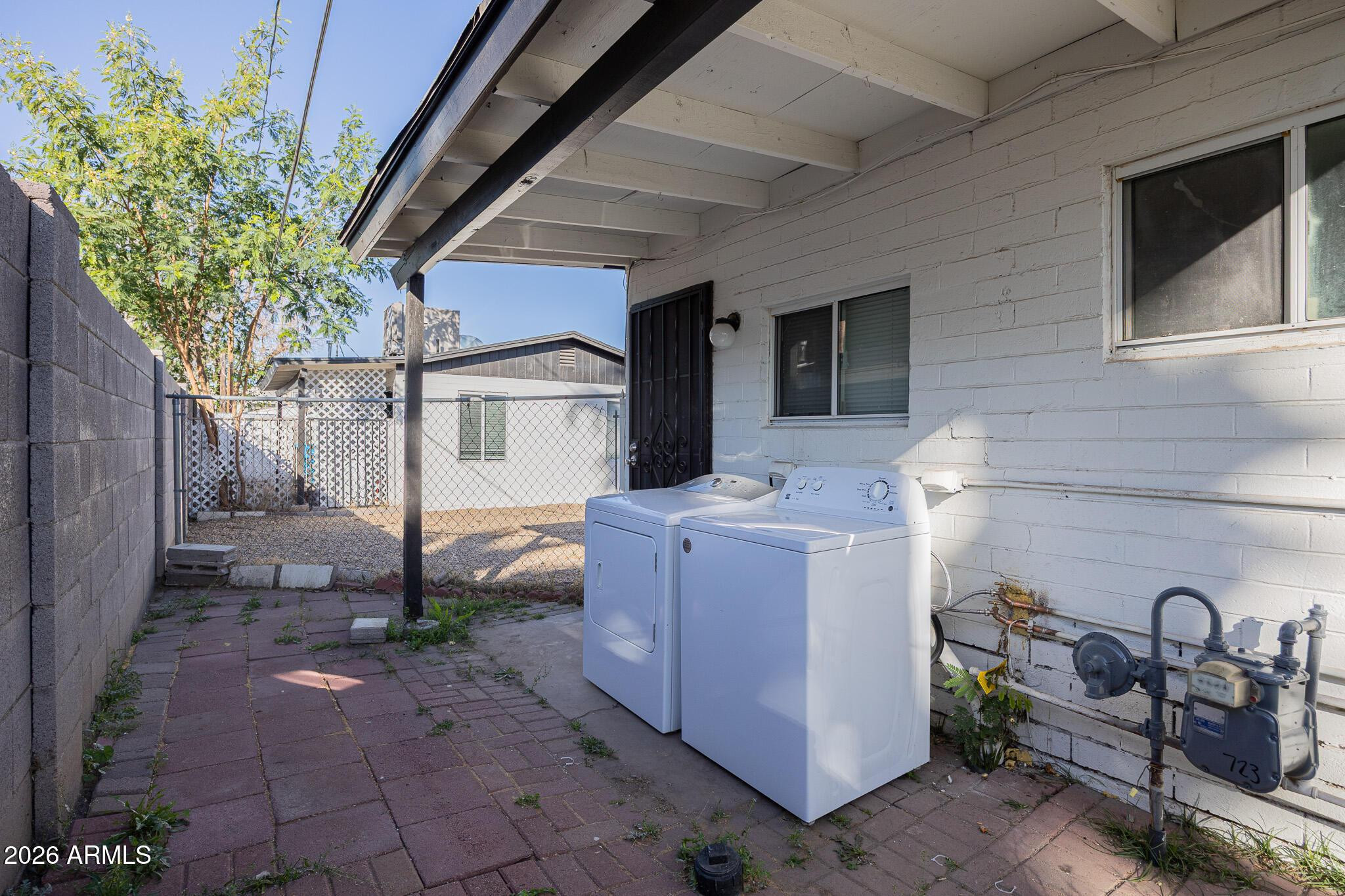 4208 North 17th Street, Unit 2 Phoenix, AZ 85016 - Photo 16 of 18 a backyard of a house with seating space