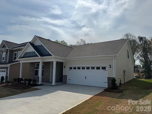 front view of a house with car parked