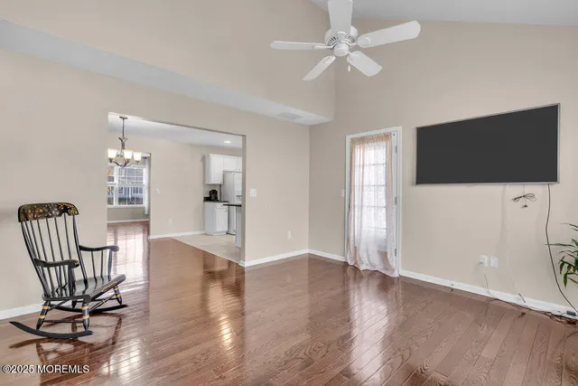 a view of a livingroom with furniture and a flat screen tv