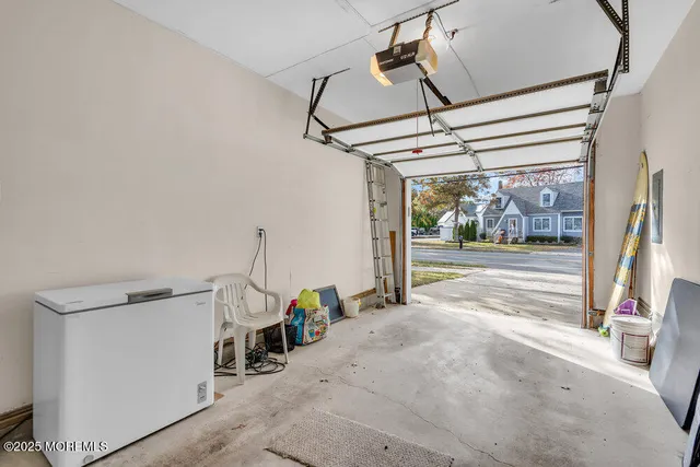 a view of a room with wooden floor and windows