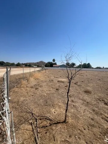 a view of wooden floor and fence