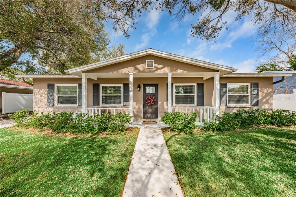 2909 West Winthrop Road Tampa, FL 33611 - Photo 1 of 1 front view of a house with a yard