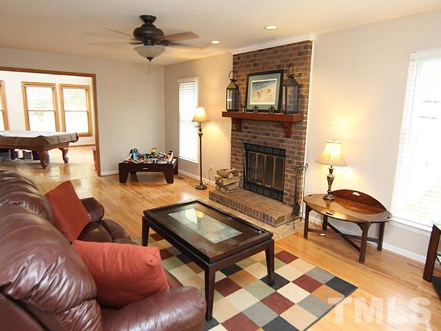 5412 Middleton Road Durham, NC 27713 - Photo 2 of 18 a living room with furniture and a fireplace