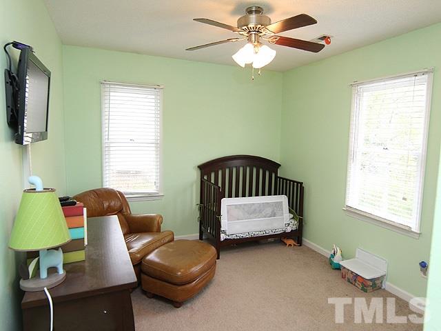 5412 Middleton Road Durham, NC 27713 - Photo 12 of 18 a bedroom with a bed and a window