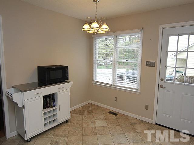 5412 Middleton Road Durham, NC 27713 - Photo 8 of 18 a view of a utility room with windows and cabinet