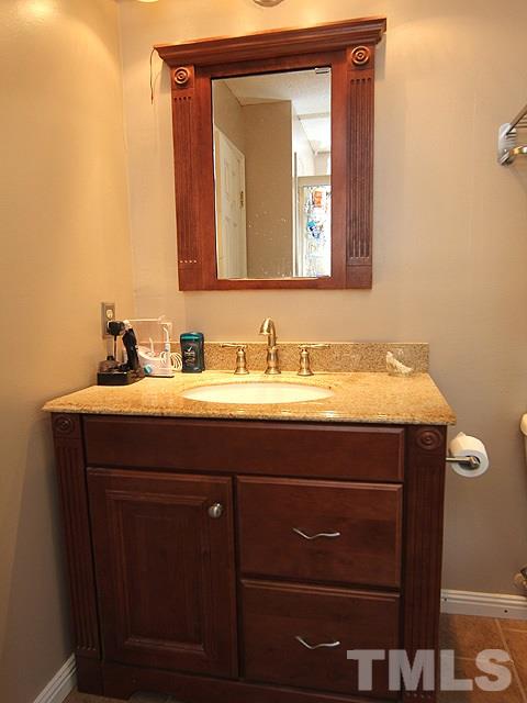 5412 Middleton Road Durham, NC 27713 - Photo 10 of 18 a bathroom with a sink vanity and mirror