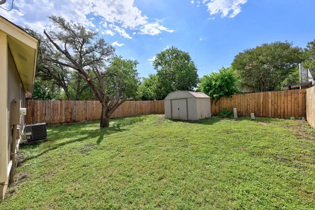 a house view with a backyard space