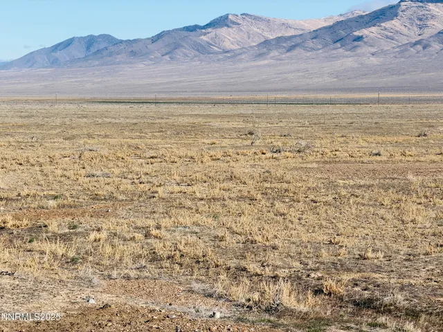 a view of an ocean and a mountain