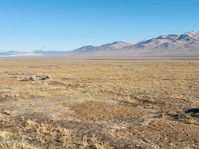 a view of an ocean and a mountain