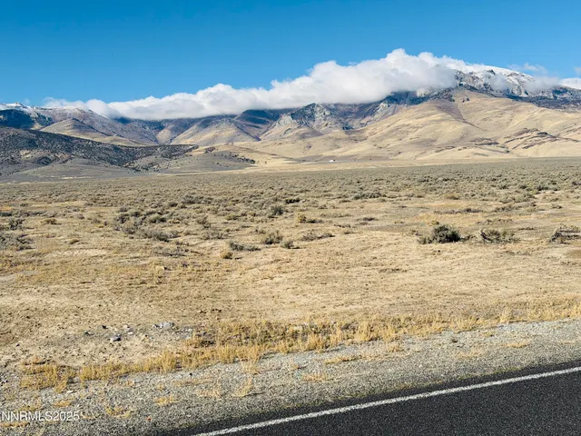 a view of a street with an ocean view