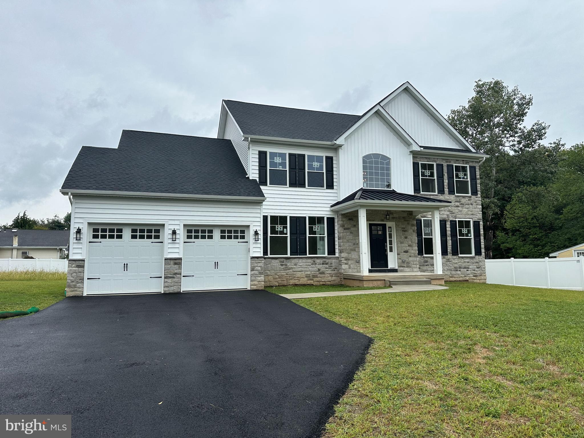 a view of house with outdoor space and swimming pool
