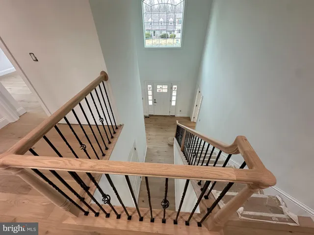 a view of staircase with wooden floor
