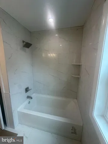 a bathroom with a bathtub