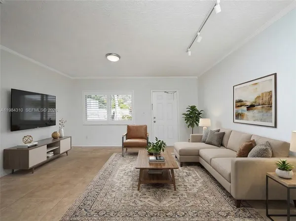 a living room with furniture and a flat screen tv