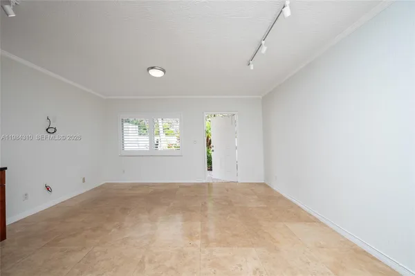 a view of an empty room with a window