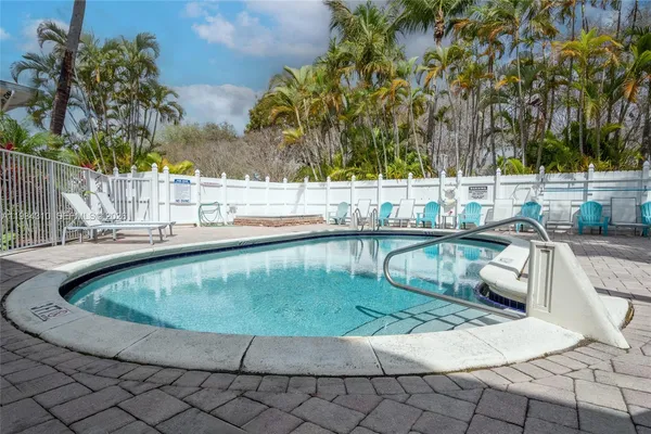 a view of a swimming pool with a patio