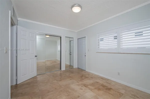 a view of an empty room and window