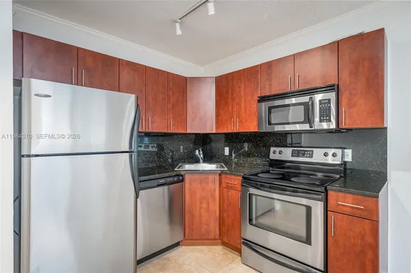 a white refrigerator freezer sitting in a kitchen