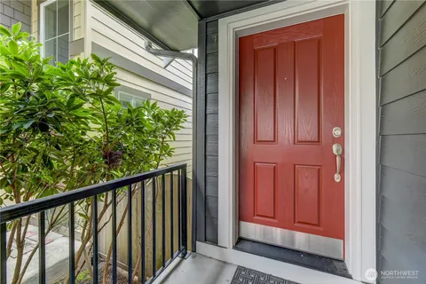 a view of a balcony with a red door