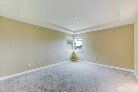a view of an empty room with windows