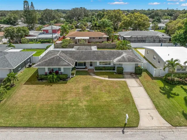 an aerial view of a house with swimming pool
