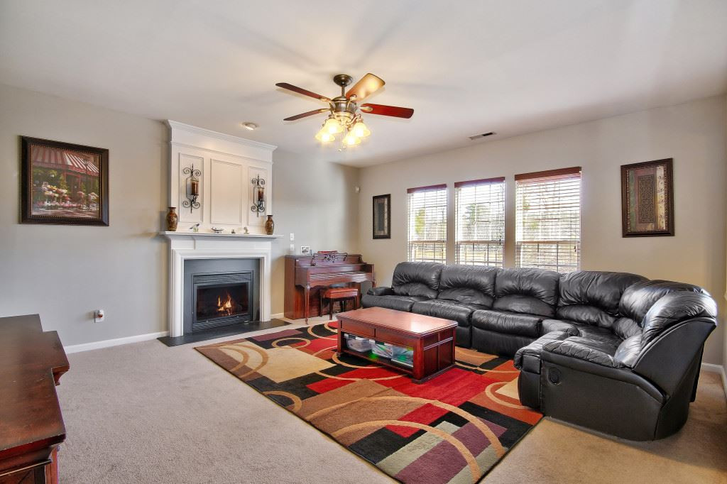 7754 San Gabriel Street Raleigh, NC 27613 - Photo 14 of 25 Cozy up to the gas fireplace during the winter with some hot cocoa and marshmallows. Family Room