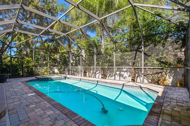 a view of a backyard with swimming pool