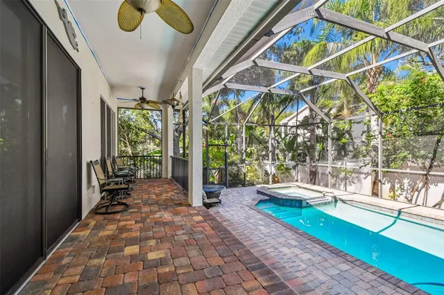 a porch with a table and chairs