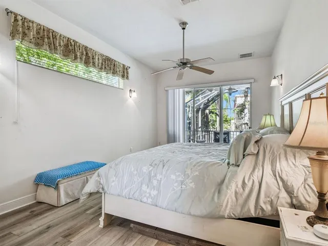 a bathroom with a granite countertop sink a large mirror and a shower