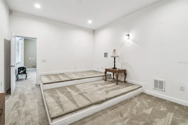 a view of a livingroom with furniture and a flat screen tv