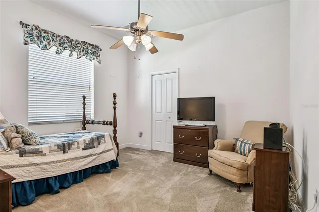 a bathroom with a granite countertop sink mirror toilet and bathtub