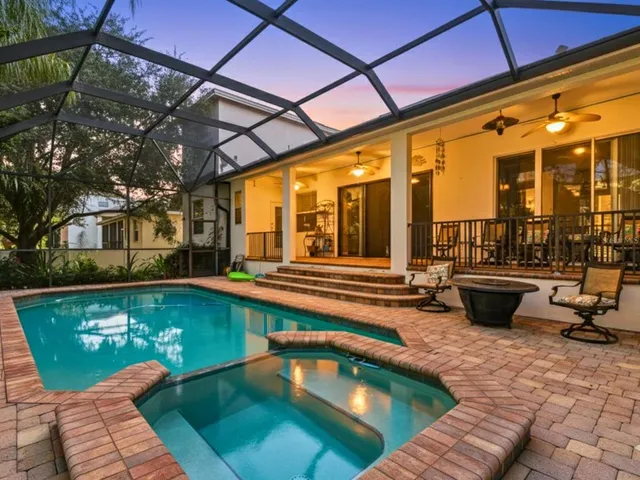 a view of a swimming pool with patio