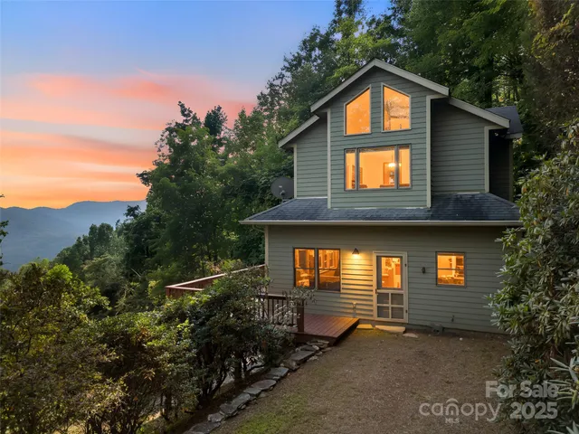 a view of backyard with plants and trees