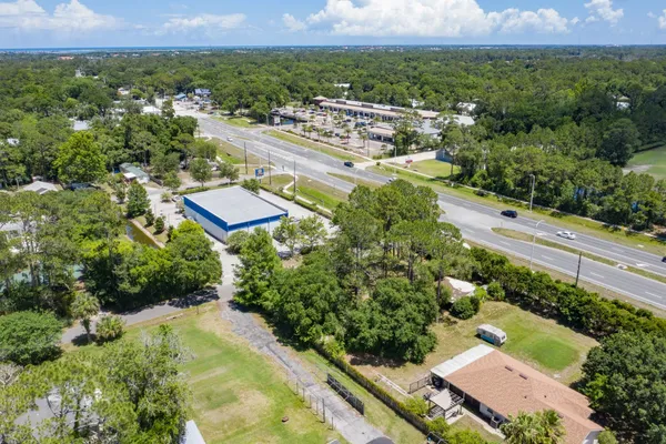 an aerial view of residential houses with outdoor space