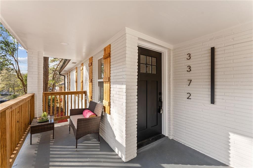 3372 Jackson Drive Decatur, GA 30032 - Photo 3 of 26 a balcony with furniture and wooden floor
