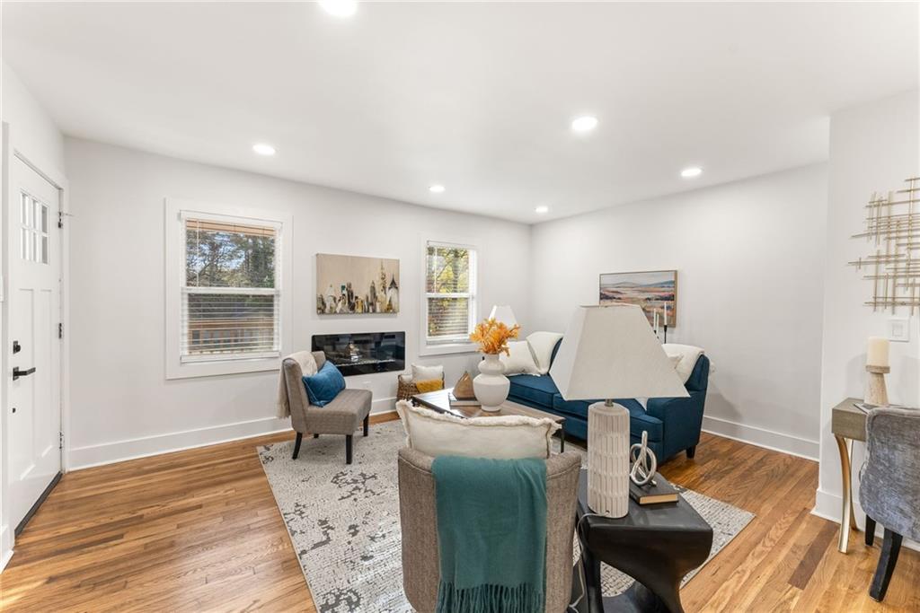 3372 Jackson Drive Decatur, GA 30032 - Photo 5 of 26 a living room with furniture a wooden floor and next to a window