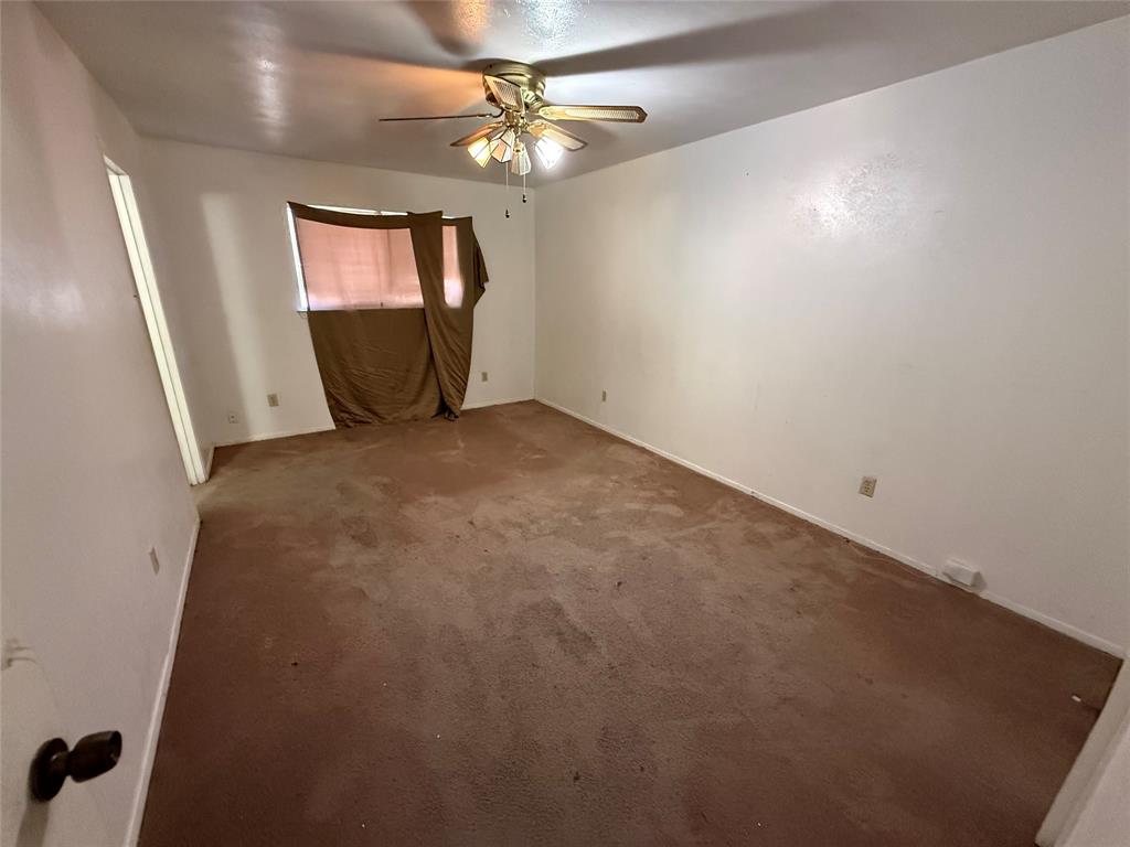1334 Rutherford Drive Mesquite, TX 75149 - Photo 18 of 22 wooden floor in an empty room with a window