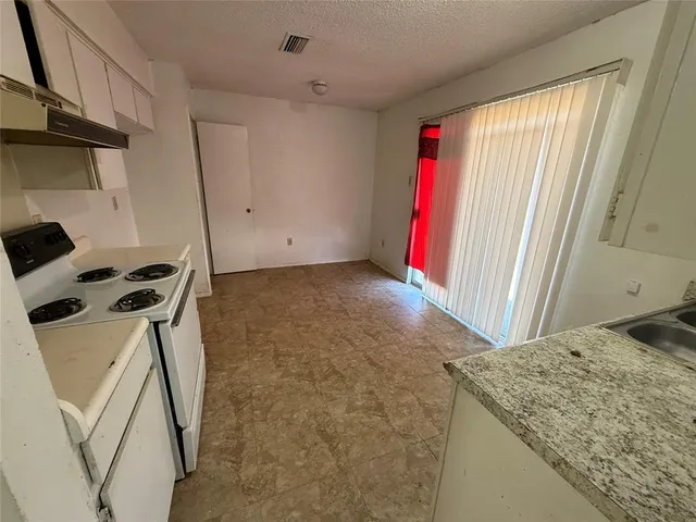 a view of a kitchen with a sink