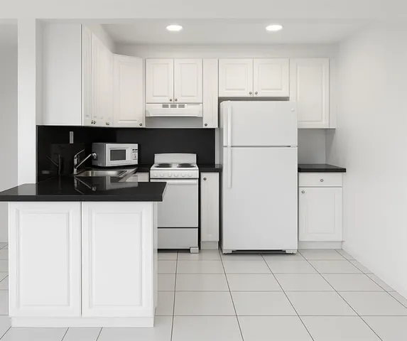 a kitchen with a cabinets a refrigerator and a stove top oven
