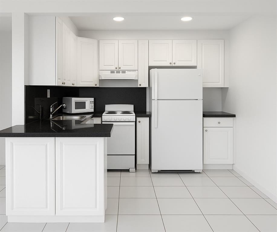 a kitchen with a cabinets a refrigerator and a stove top oven