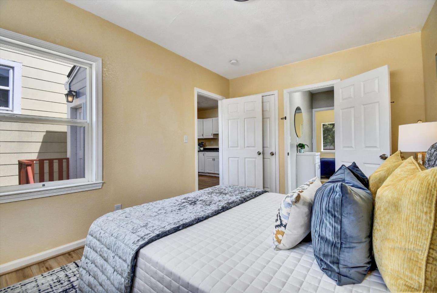 324 Holloway Avenue San Francisco, CA 94112 - Photo 11 of 37 a bedroom with a bed and a window