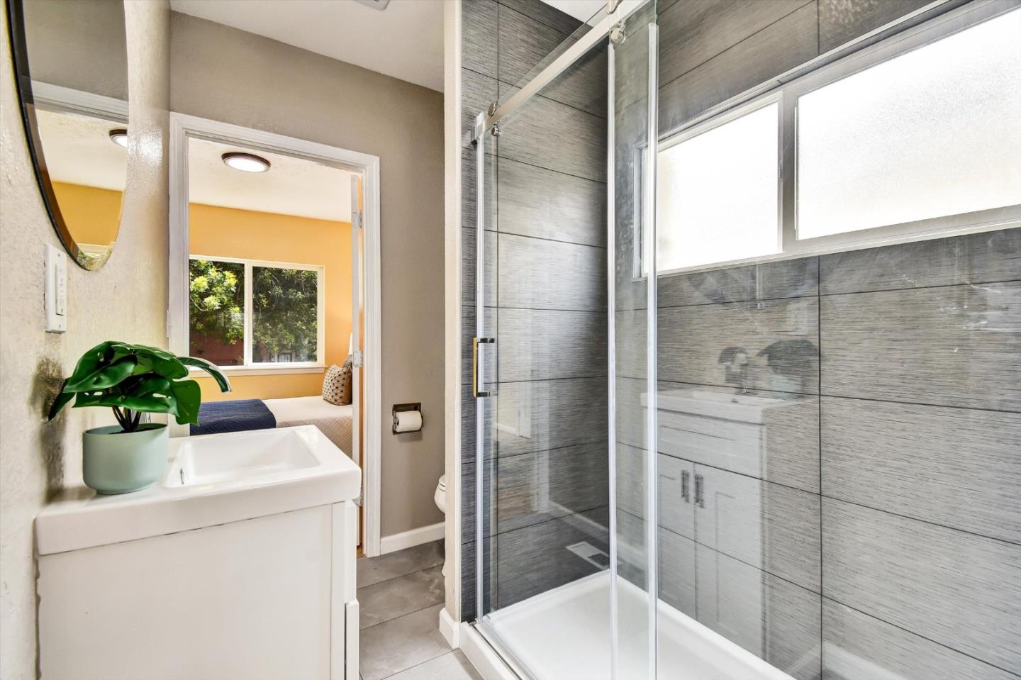 324 Holloway Avenue San Francisco, CA 94112 - Photo 12 of 37 a bathroom with a sink toilet and shower