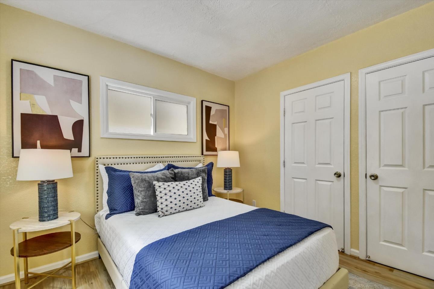 324 Holloway Avenue San Francisco, CA 94112 - Photo 15 of 37 a bedroom with a bed and wooden floor