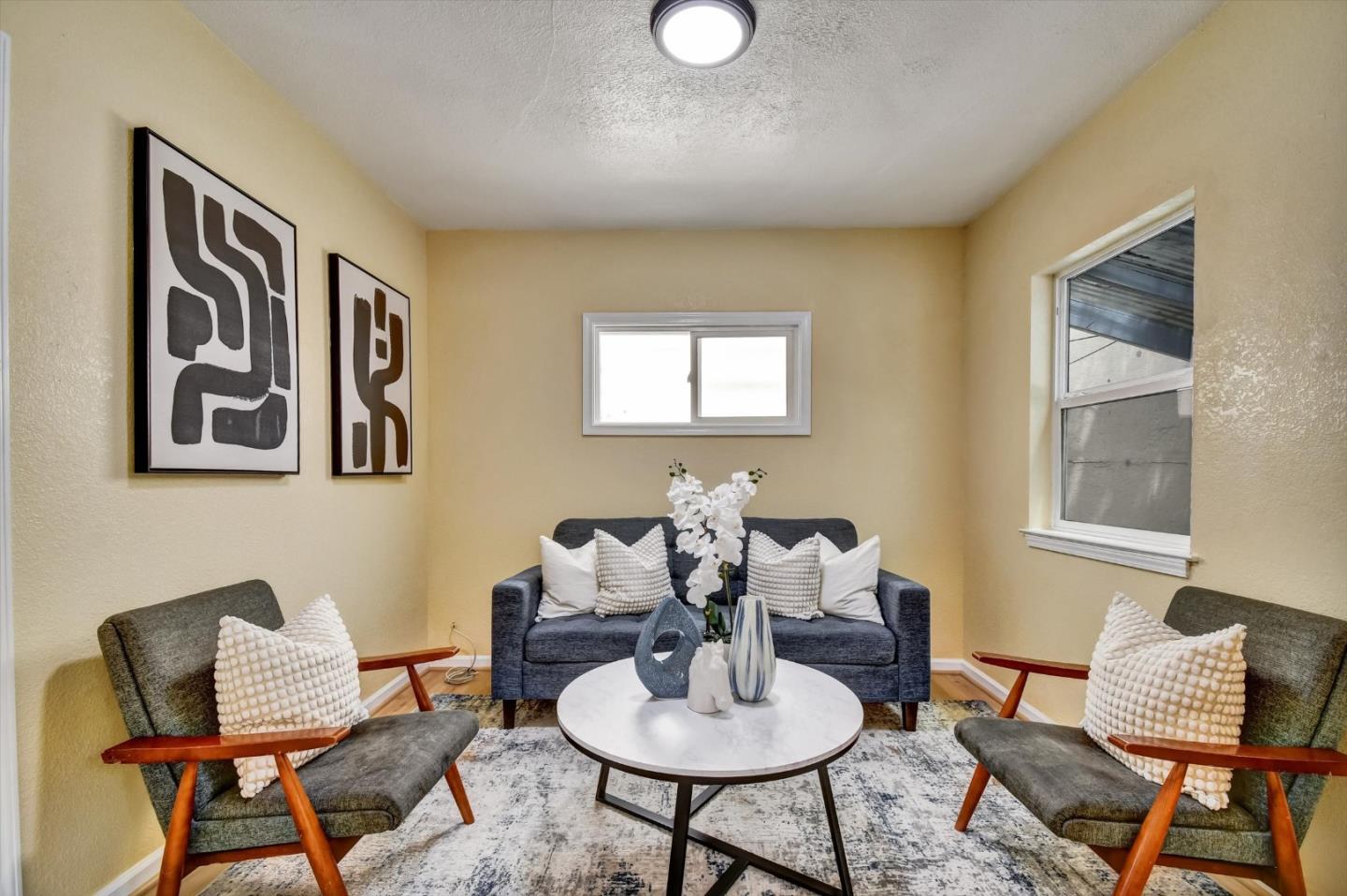 324 Holloway Avenue San Francisco, CA 94112 - Photo 2 of 37 a living room with furniture and a window