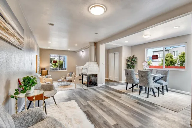 a view of a dining room with furniture window and wooden floor