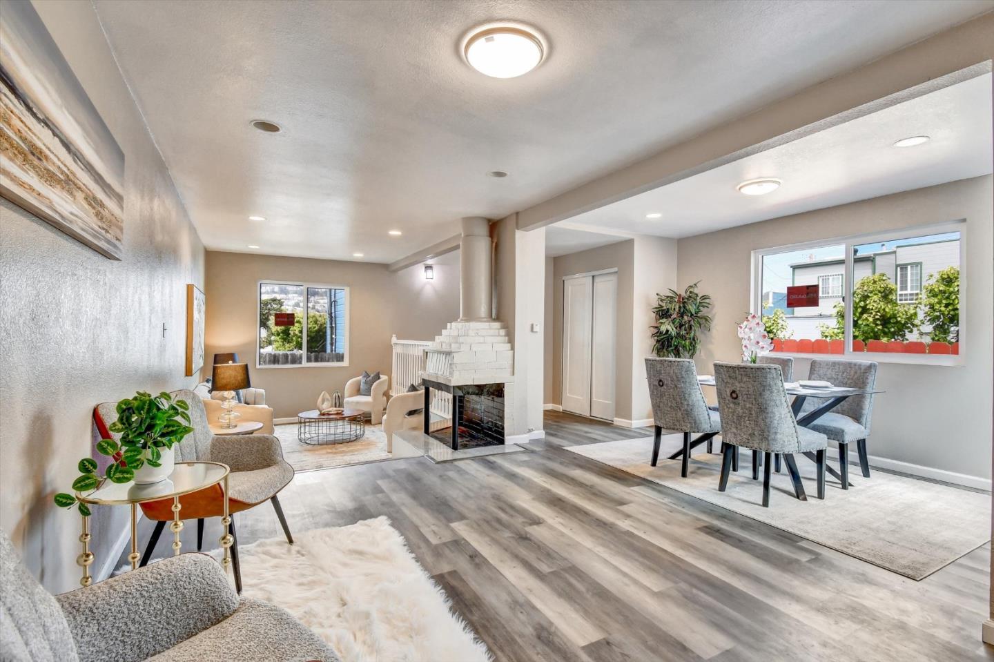 324 Holloway Avenue San Francisco, CA 94112 - Photo 22 of 37 a living room with furniture a dining table and a potted plant