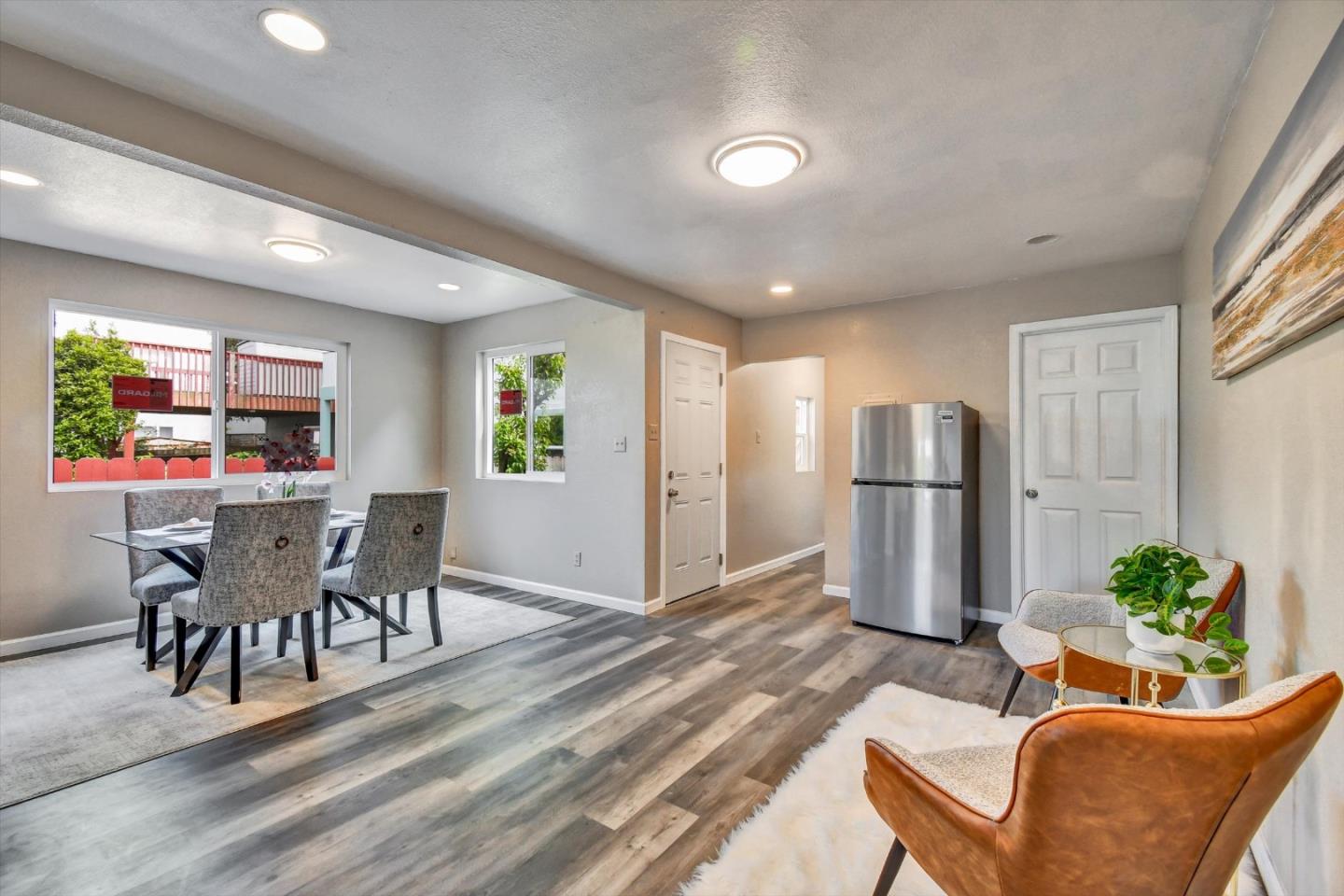 324 Holloway Avenue San Francisco, CA 94112 - Photo 23 of 37 a view of a dining room with furniture window and wooden floor