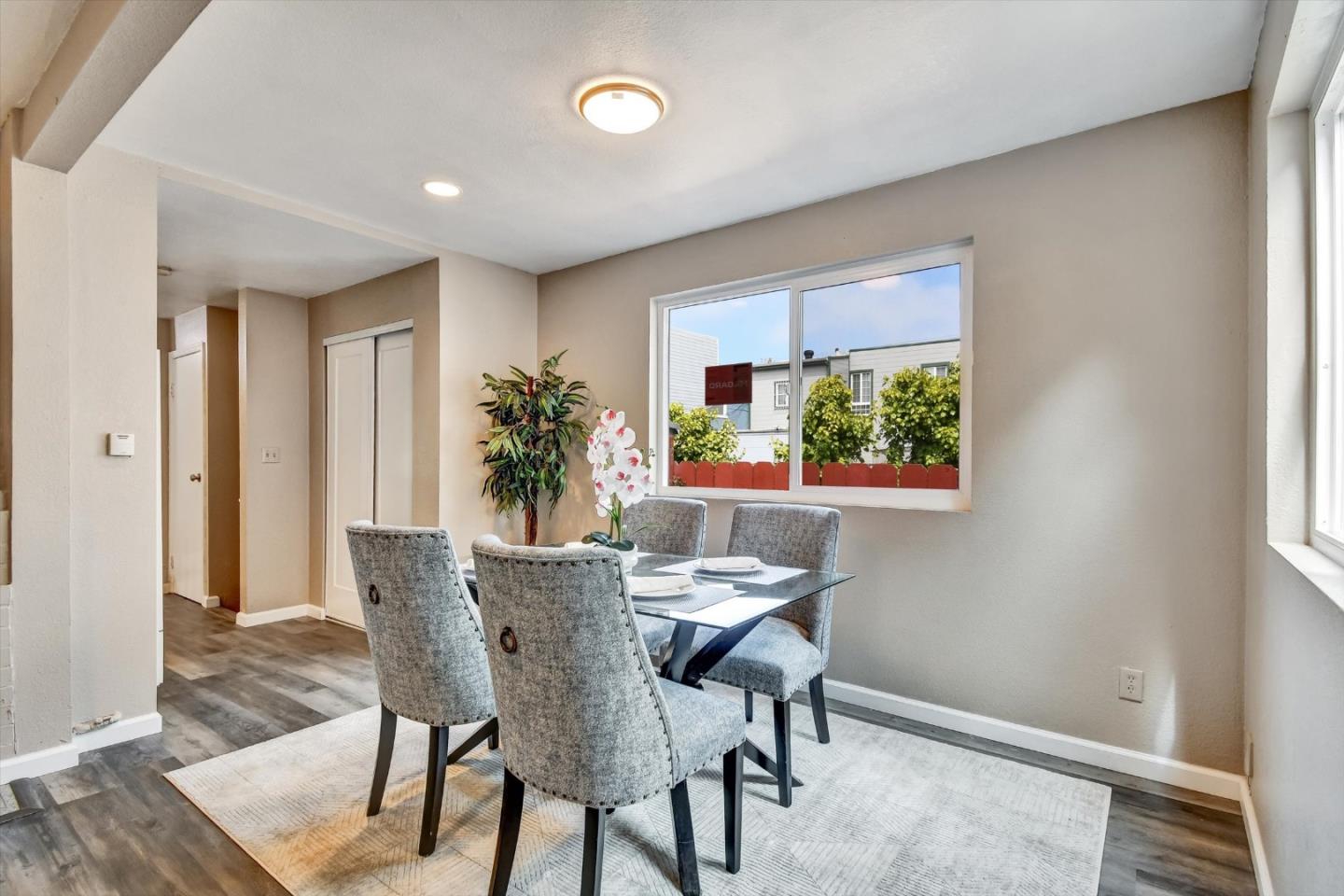 324 Holloway Avenue San Francisco, CA 94112 - Photo 28 of 37 a view of a dining room with furniture window and wooden floor