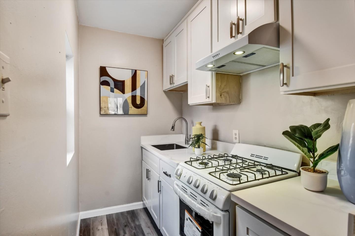 324 Holloway Avenue San Francisco, CA 94112 - Photo 29 of 37 a kitchen with stainless steel appliances granite countertop a stove a sink and a refrigerator