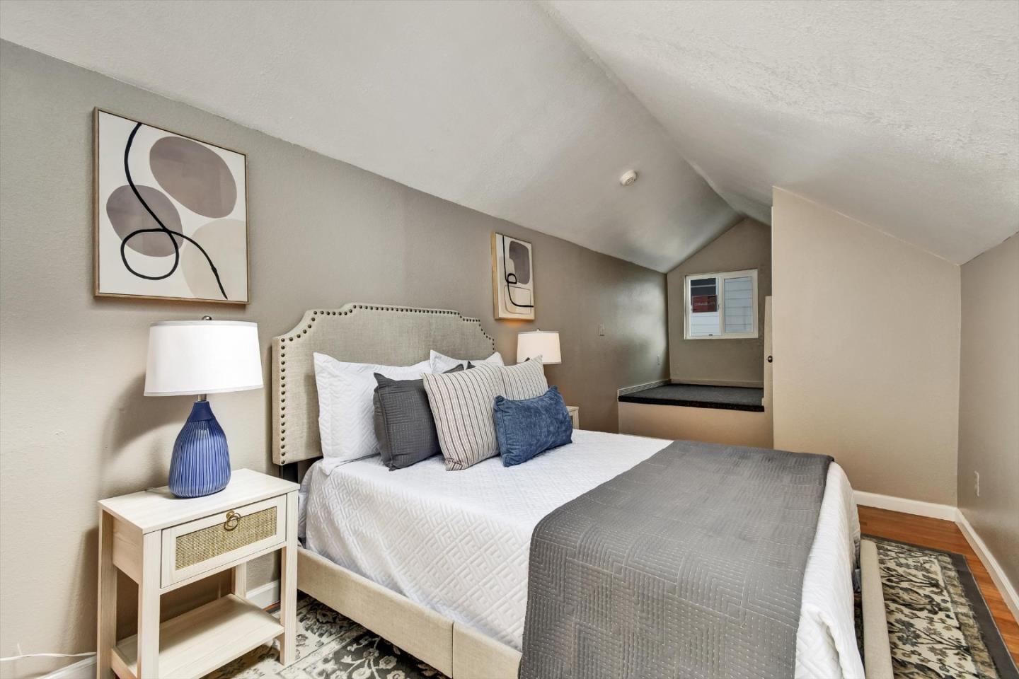 324 Holloway Avenue San Francisco, CA 94112 - Photo 34 of 37 a bedroom with bed and wooden floor